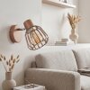 Wandlamp Keldor met bruine metalen kooikap, draai- en zwenkbare lampkop voor de leeshoek