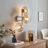 Moderne wandlamp Koyoto met drie ronde bollen in amber en helder, in clusteropstelling