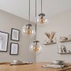 Hanglamp Gastor met drie ronde glazen kappen, hoogteverstelbaar bij montage voor de eettafel