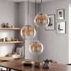 Cluster-hanglamp Gastor, bij montage verstelbaar, glazen kappen in amber en helder