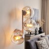 Moderne wandlamp Koyoto met drie amberkleurige en heldere glazen bollen