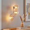 Moderne wandlamp Gastor met drie ronde glazen bollen in amber en helder