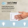 Leuchten Direkt LED wandlamp Emanda met spiraalarm in messing, 3000 Kelvin warmwit